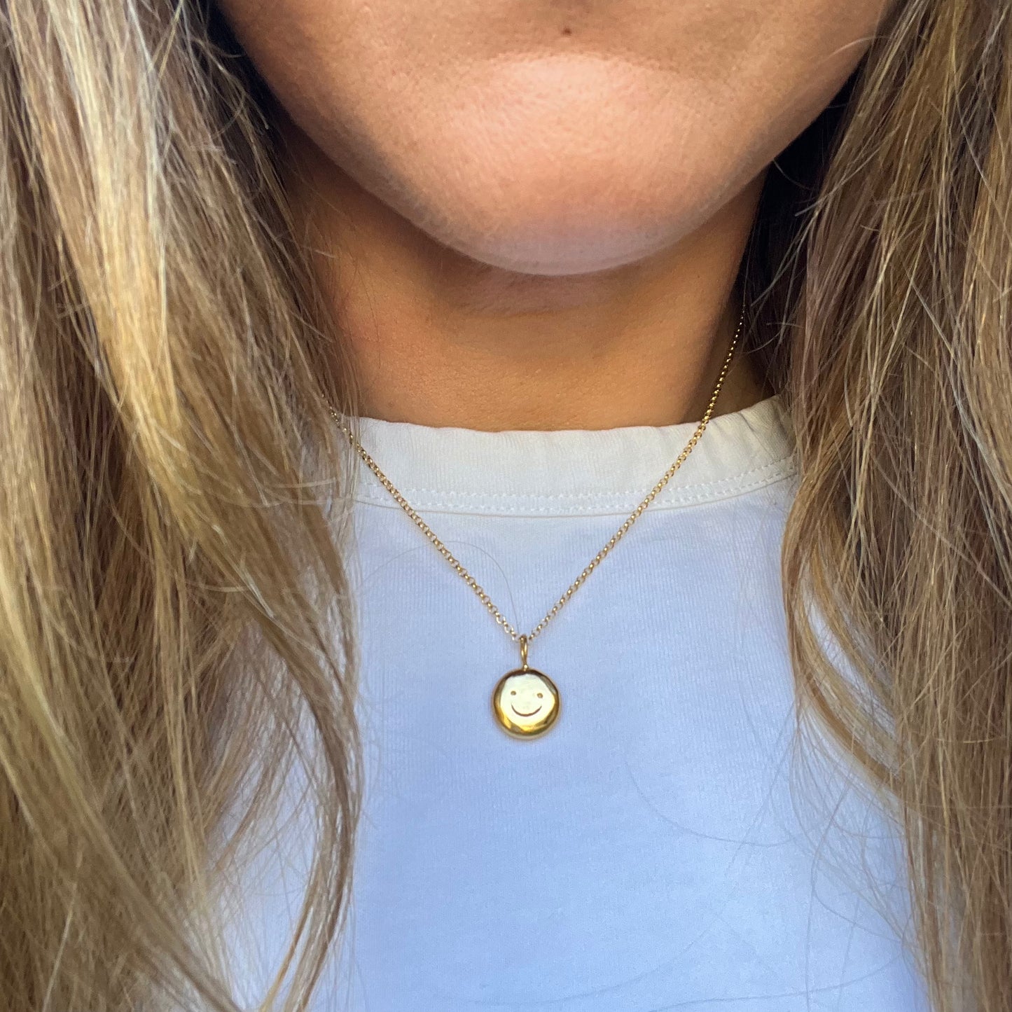 Gold plated smiley pendant