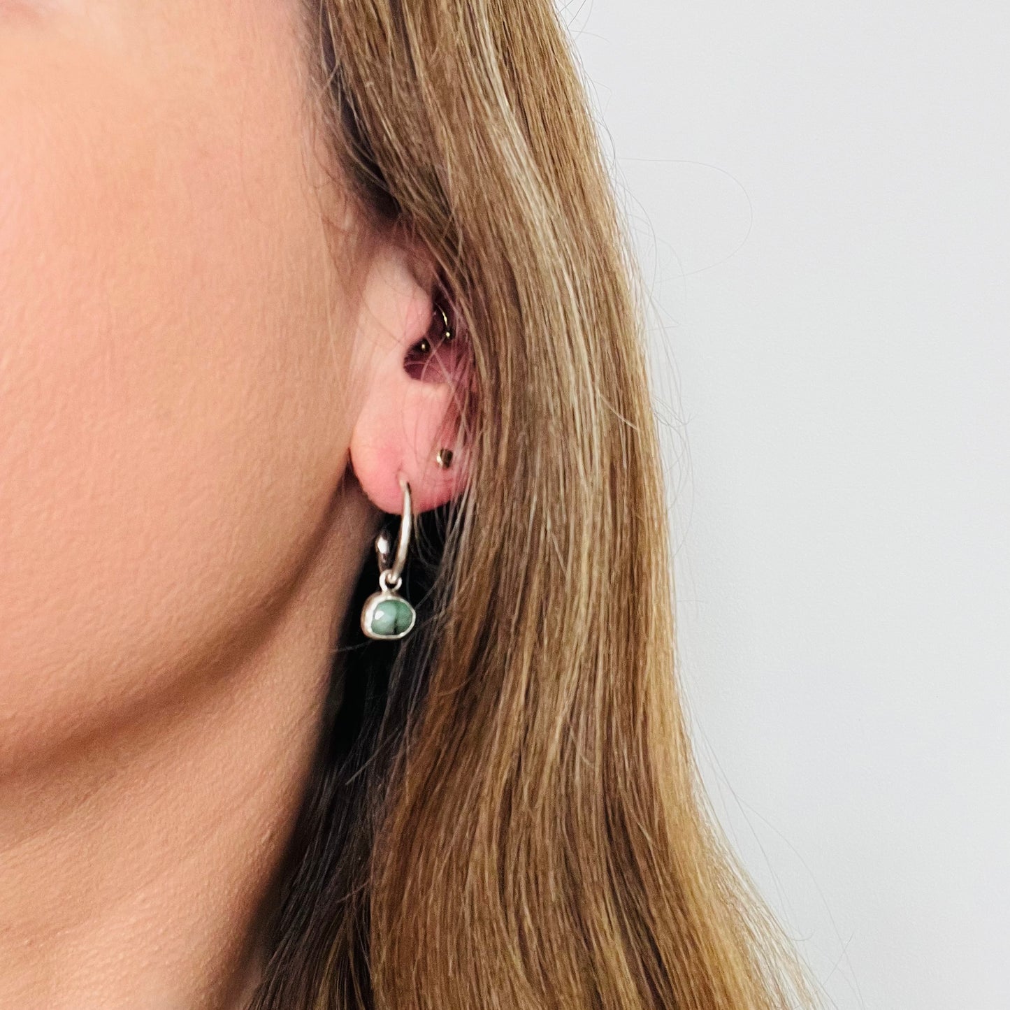 Silver and emerald charm hoops