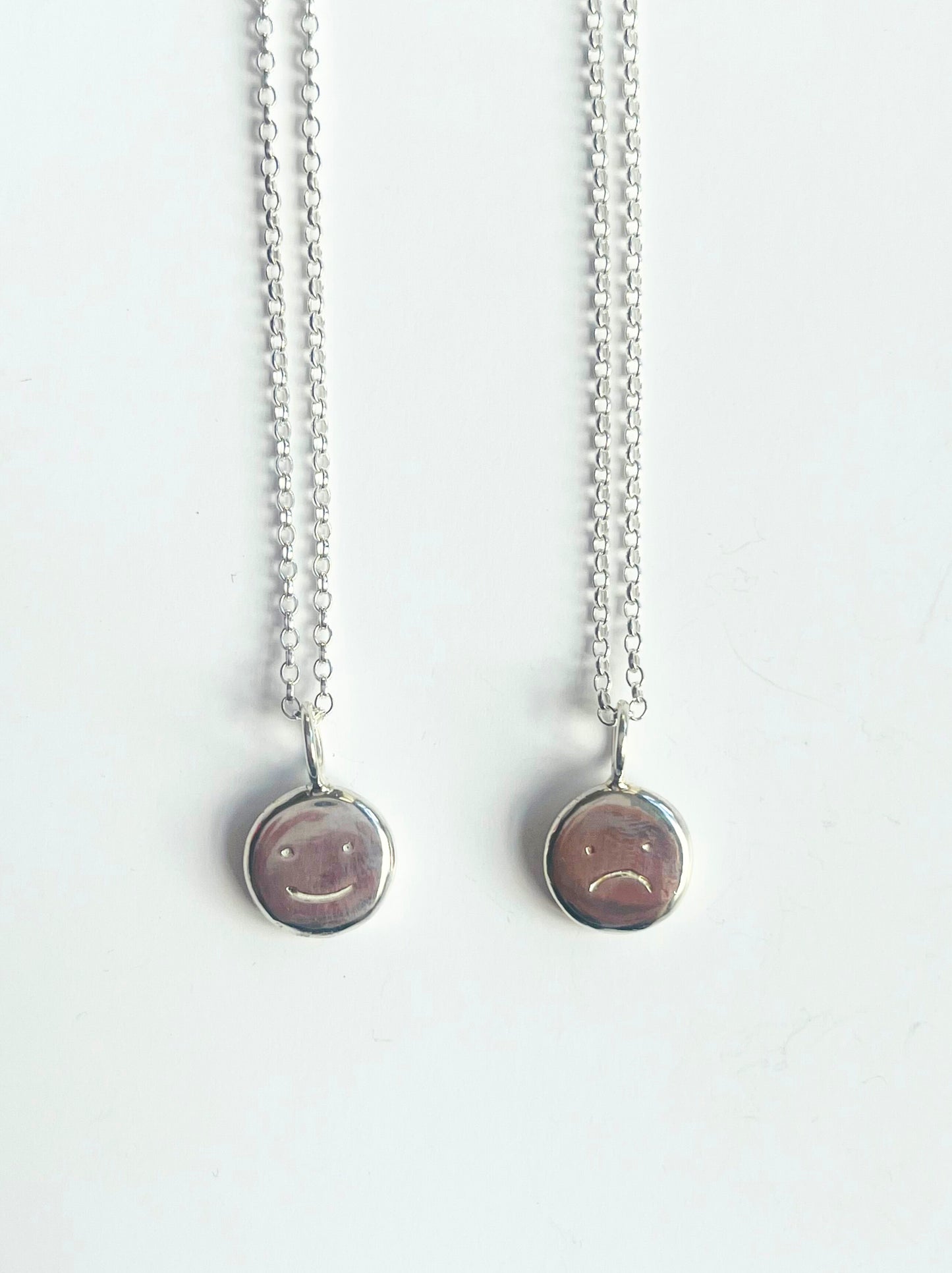 Sterling silver "moodflip" smiley pendant